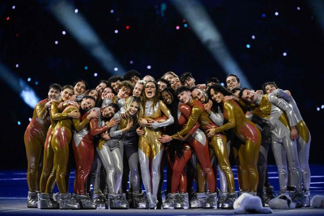 dancers perform during the opening ceremony of the Milano Cortina 2026 Winter Olympic Games at the San Siro stadium in Milan, northern Italy, on February 6, 2026. (Photo by WANG Zhao / AFP)
