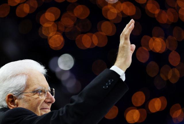 Italy's President Sergio Mattarella waves during the opening ceremony of the Milano Cortina 2026 Winter Olympic Games in Milan, northern Italy, on February 6, 2026. (Photo by Susana Vera / POOL / AFP)