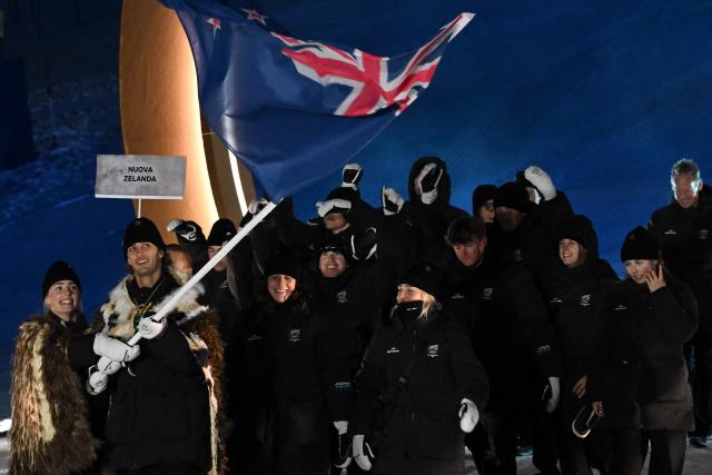 Flag bearers Zoi Sadowski-Synnott and Ben Barclay of Team New Zealand enter with the delegation during the opening ceremony of the Milano Cortina 2026 Winter Olympic Games in Livigno, northern Italy, on February 6, 2026. (Photo by Jeff PACHOUD / AFP)