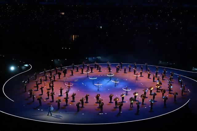 Dancers perform during the opening ceremony of the Milano Cortina 2026 Winter Olympic Games at the San Siro stadium in Milan, northern Italy, on February 6, 2026. (Photo by PIERO CRUCIATTI / AFP)
