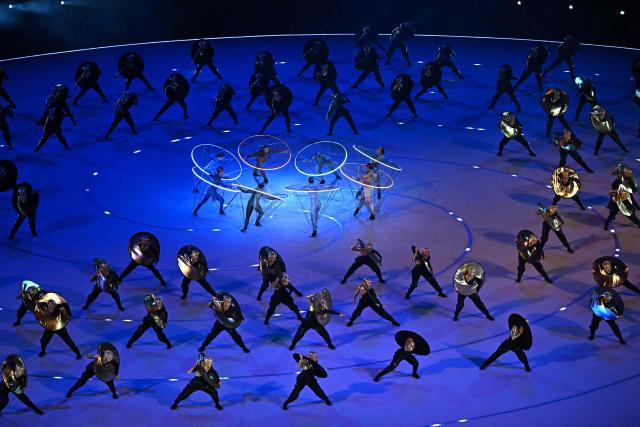 Dancers perform during the opening ceremony of the Milano Cortina 2026 Winter Olympic Games at the San Siro stadium in Milan, northern Italy, on February 6, 2026. (Photo by Gabriel BOUYS / AFP)