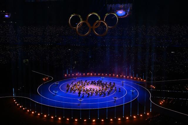 Dancers perform during the opening ceremony of the Milano Cortina 2026 Winter Olympic Games at the San Siro stadium in Milan, northern Italy, on February 6, 2026. (Photo by PIERO CRUCIATTI / AFP)