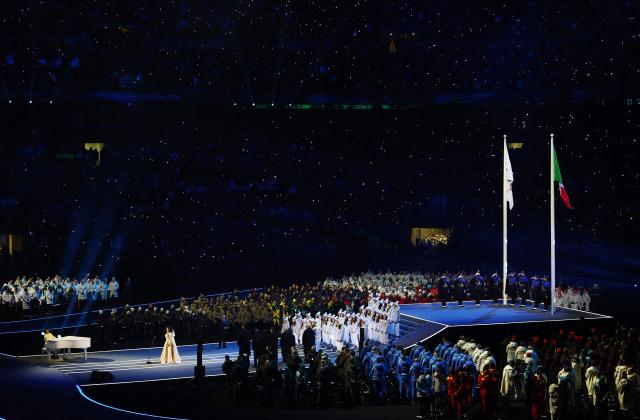 Chinese pianist Lang Lang (LL) and Italian opera singer Cecilia Bartoli perform during the opening ceremony of the Milano Cortina 2026 Winter Olympic Games in Milan, northern Italy, on February 6, 2026. (Photo by Susana Vera / POOL / AFP)
