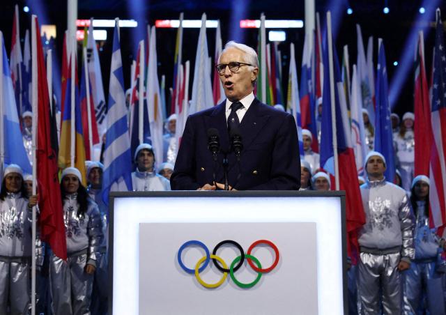 President of the Organising Committee for the 2026 Olympic and Paralympic Winter Games Giovanni Malago delivers a speech during the opening ceremony of the Milano Cortina 2026 Winter Olympic Games at the San Siro stadium in Milan, northern Italy, on February 6, 2026. (Photo by Yves Herman / POOL / AFP)