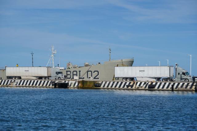 A naval supplies truck is pictured beside the Isla Holbox (BAL-02) vessel belonging to the Mexican Navy (SEMAR), intended for humanitarian aid, which is docked at Veracruz port in Veracruz, Mexico, on February 6, 2026. Mexico will ship humanitarian aid to Cuba in the coming days while continuing to negotiate with Washington on the possibility of circumventing a US oil siege, President Claudia Sheinbaum said on February 6. (Photo by Victoria Razo / AFP)