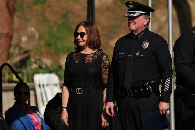 Teresa Sanchez-Gordon, president of the Los Angeles Police Commission, and Los Angeles Police Department (LAPD) Chief Jim McDonnell inspect recruits from class 8-25 during their graduation ceremony at the Los Angeles Police Academy in Los Angeles, California on February 6, 2026. The Los Angeles Police Academy holds a graduation ceremony for 26 recruit officers, including 24 for the LAPD, one for the Los Angeles Airport Police and one for the Los Angeles Port Police. (Photo by Patrick T. Fallon / AFP)