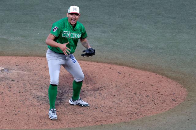 Tomateros de Culiacan's #20 Guadalupe Chavez celebrates at the end of the ninth inning of the Caribbean Series baseball tournament semi-final game between Mexico's Tomateros de Culiacan and Dominican Republic's Leones del Escogido at the Panamerican Stadium in Jalisco, Mexico, on February 6, 2026. (Photo by Ulises Ruiz / AFP)