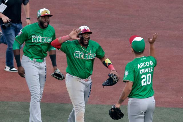 Players Tomateros de Culiacan celebrate at the end of the ninth inning of the Caribbean Series baseball tournament semi-final game between Mexico's Tomateros de Culiacan and Dominican Republic's Leones del Escogido at the Panamerican Stadium in Jalisco, Mexico, on February 6, 2026. (Photo by Ulises Ruiz / AFP)