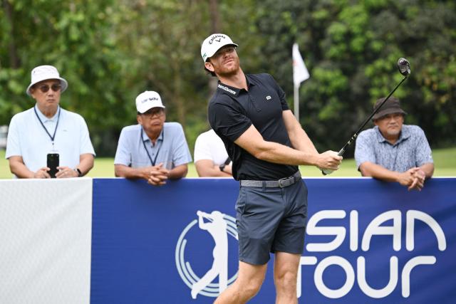 USA's Marcus Plunkett tees off during the third round of the Philippines Golf Championship tournament at the Wack Wack Golf and Country Club in Manila on February 7, 2026. (Photo by Ted ALJIBE / AFP)