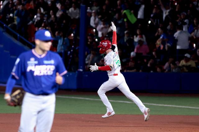 Charros de Jalisco's #79 Connor Hollis celebrates after hitting a home run in the second inning of the Caribbean Series baseball tournament semi-final game between Mexico's Charros de Jalisco and Puerto Rico's Cangrejeros de Santurce at the Panamerican Stadium in Jalisco, Mexico, on February 6, 2026. (Photo by Ulises Ruiz / AFP)