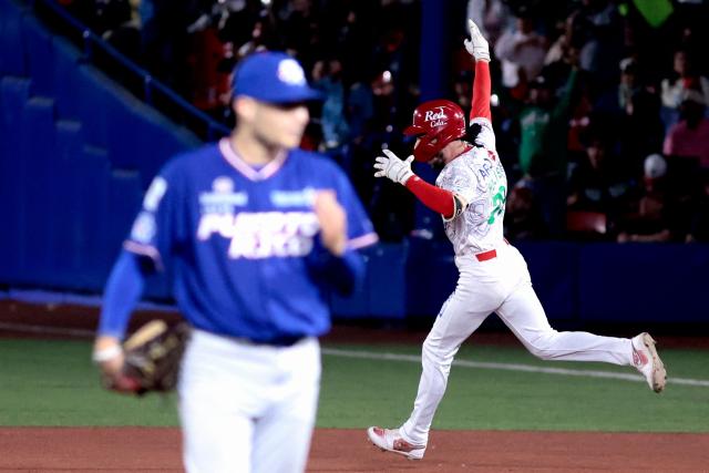 Charros de Jalisco's #79 Connor Hollis celebrates after hitting a home run in the second inning of the Caribbean Series baseball tournament semi-final game between Mexico's Charros de Jalisco and Puerto Rico's Cangrejeros de Santurce at the Panamerican Stadium in Jalisco, Mexico, on February 6, 2026. (Photo by Ulises Ruiz / AFP)