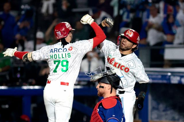 Charros de Jalisco's #79 Connor Hollis celebrates with a teammate after hitting a home run in the second inning of the Caribbean Series baseball tournament semi-final game between Mexico's Charros de Jalisco and Puerto Rico's Cangrejeros de Santurce at the Panamerican Stadium in Jalisco, Mexico, on February 6, 2026. (Photo by Ulises Ruiz / AFP)