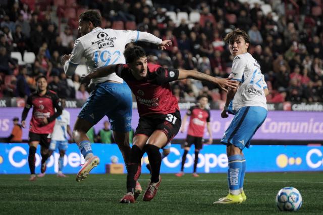 Puebla's forward #192 Eduardo Navarro, Tijuana's forward #31 Diego Abreu and Puebla's midfielder #12 Iker Moreno fight for the ball during the Liga MX Clausura football match between Tijuana and Puebla at the Caliente Stadium in Tijuana, Mexico, on February 6, 2026. (Photo by Guillermo Arias / AFP)