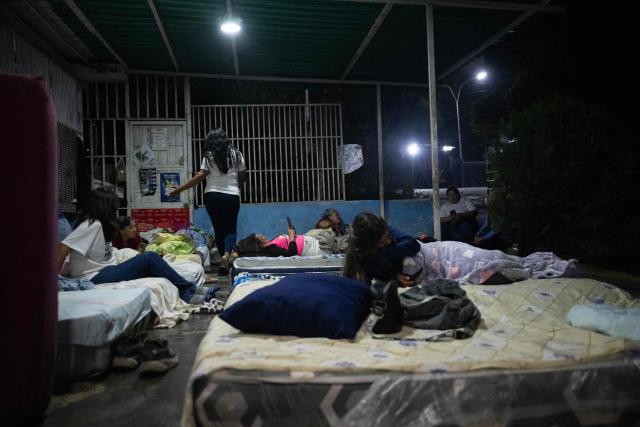 Relatives of inmates camp outside El Rodeo I prison in Guatire, Miranda state, some 30 kilometers east of Caracas, on February 6, 2026, awaiting news of prisoner releases. The president of the Venezuelan Parliament met on Friday with relatives of political prisoners at a detention facility in Caracas and promised their release within a week at the latest. (Photo by Maryorin Mendez / AFP)