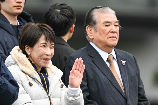 Japan's Prime Minister and President of the Liberal Democratic Party (LDP) Sanae Takaichi (L) waves to the people upon her arrival to deliver a campaign speech ahead of the House of Representatives election, at Rekisen Park in Tokyo on February 7, 2026. (Photo by Philip FONG / AFP)