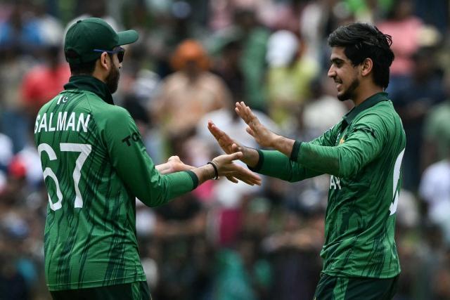 Pakistan's Saim Ayub (R) celebrates with captain Salman Agha after taking the wicket of Netherlands' Logan van Beek during the 2026 ICC Men's T20 Cricket World Cup group stage match between Pakistan and Netherlands at the Sinhalese Sports Club (SSC) Ground in Colombo on February 7, 2026. (Photo by Ishara S. KODIKARA / AFP)