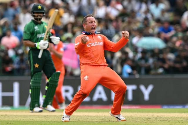 TOPSHOT - Netherlands' Roelof van der Merwe celebrates after taking the wicket of Pakistan's Babar Azam during the 2026 ICC Men's T20 Cricket World Cup group stage match between Pakistan and Netherlands at the Sinhalese Sports Club (SSC) Ground in Colombo on February 7, 2026. (Photo by Ishara S. KODIKARA / AFP)