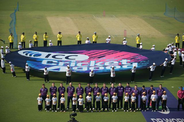 Scotland's players stand during their national anthem at the start of the 2026 ICC Men's T20 Cricket World Cup group stage match between Scotland and West Indies at the Eden Gardens in Kolkata on February 7, 2026. (Photo by Dibyangshu SARKAR / AFP)