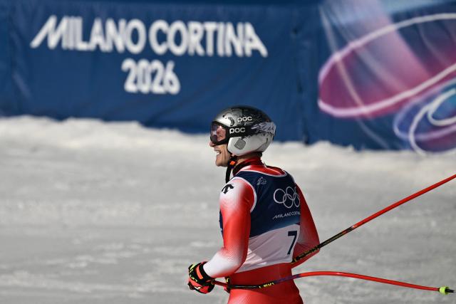 Switzerland's Marco Odermatt reacts in the finish area after competing in the men's downhill alpine skiing event during the Milano Cortina 2026 Winter Olympic Games at the Stelvio Ski Centre in Bormio (Valtellina) on February 7, 2026. (Photo by Jeff PACHOUD / AFP)