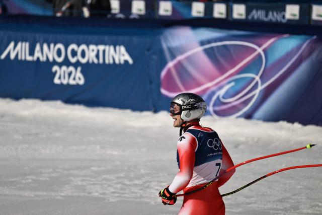 Switzerland's Marco Odermatt reacts in the finish area after competing in the men's downhill alpine skiing event during the Milano Cortina 2026 Winter Olympic Games at the Stelvio Ski Centre in Bormio (Valtellina) on February 7, 2026. (Photo by Jeff PACHOUD / AFP)