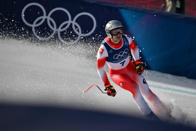 Switzerland's Marco Odermatt reacts in the finish area after competing in the men's downhill alpine skiing event during the Milano Cortina 2026 Winter Olympic Games at the Stelvio Ski Centre in Bormio (Valtellina) on February 7, 2026. (Photo by Jeff PACHOUD / AFP)
