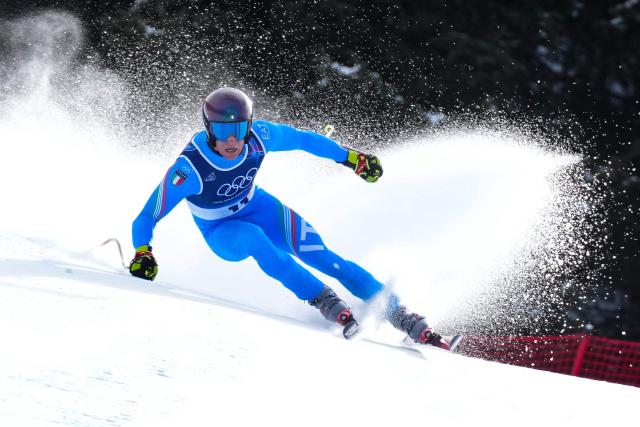 Italy's Giovanni Franzoni competes in the men's downhill alpine skiing event during the Milano Cortina 2026 Winter Olympic Games at the Stelvio Ski Centre in Bormio (Valtellina) on February 7, 2026. (Photo by Dimitar DILKOFF / AFP)