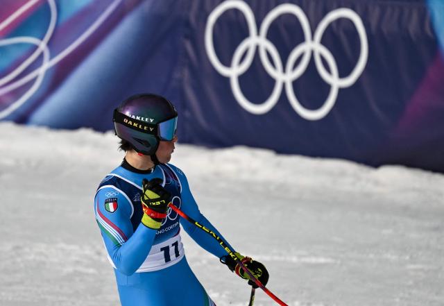 Italy's Giovanni Franzoni reacts in the finish area after competing in the men's downhill alpine skiing event during the Milano Cortina 2026 Winter Olympic Games at the Stelvio Ski Centre in Bormio (Valtellina) on February 7, 2026. (Photo by Jeff PACHOUD / AFP)