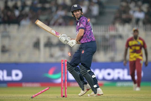 Scotland's Brandon McMullen is clean bowled during the 2026 ICC Men's T20 Cricket World Cup group stage match between Scotland and West Indies at the Eden Gardens in Kolkata on February 7, 2026. (Photo by Dibyangshu SARKAR / AFP)