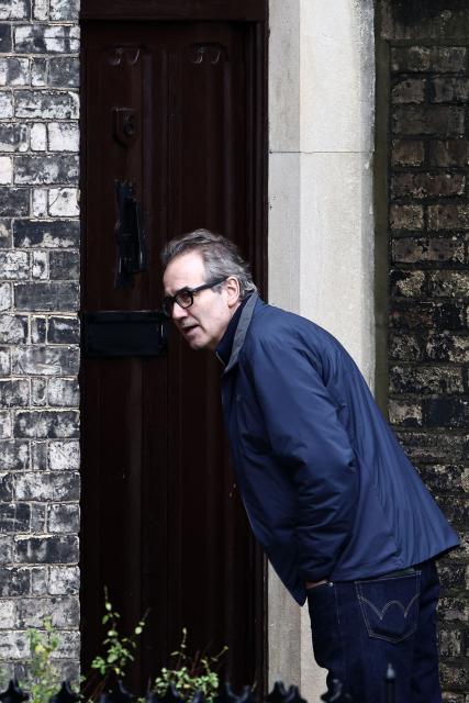 A person stands outside the residence of Former UK ambassador to the United States, Peter Mandelson, in central London on February 7, 2025. UK police probing Mandelson searched two properties on February 6, 2026, London's Metropolitan Police said, following fresh revelations in the Epstein files. The searches came as Prime Minister Keir Starmer faces intense scrutiny over his decision to appoint Mandelson as the country's US envoy despite his association with convicted US sex offender Jeffrey Epstein. (Photo by Henry NICHOLLS / AFP)