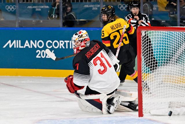 Japan's goalkeeper #31 Riko Kawaguchi (L) reacts after Germany's forward #25 Laura Kluge scored her team's fifth goal during the women's preliminary round Group B Ice Hockey match between Germany and Japan at the Milano Rho Ice Hockey Arena at the Milano Cortina 2026 Winter Olympic Games in Milan, on February 7, 2026. (Photo by Alexander NEMENOV / AFP)