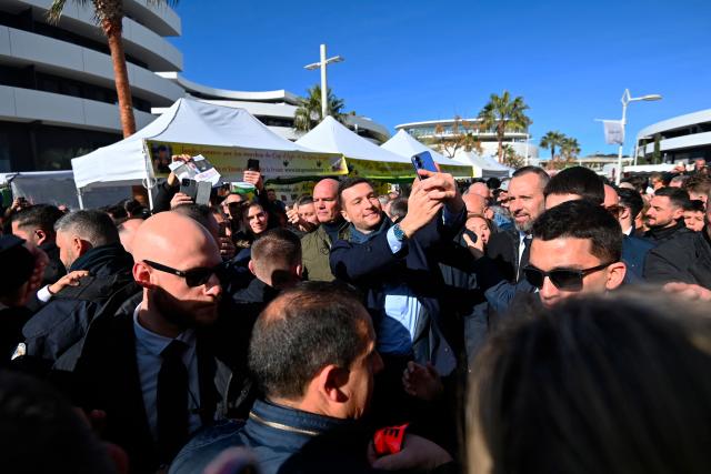 The president of French far-right Rassemblement National (RN) party and Member of the European Parliament (MEP) Jordan Bardella arrives at the Cap d'Agde market, southern France, during a visit in support of Aurélien Lopez-Liguori, lead candidate in the Agde municipal elections, on February 7, 2026. (Photo by Sylvain THOMAS / AFP)