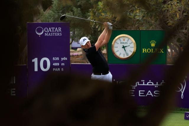Matt Wallace of England plays his tee shot on the 10th hole during the third day of the Qatar Masters 2026 golf tournament at Doha Golf Club in Doha on February 7, 2026. (Photo by Karim JAAFAR / AFP)