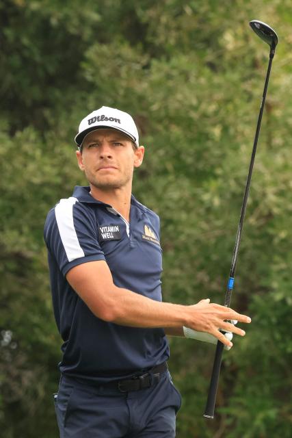 Joakim Lagergren of Sweden plays his tee shot on the 4th hole during the third day of the Qatar Masters 2026 golf tournament at Doha Golf Club in Doha on February 7, 2026. (Photo by Karim JAAFAR / AFP)