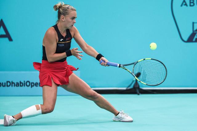 Czech Republic's Sara Bejlek hits a return against Russia’s Ekaterina Alexandrova during their women’s singles final match at the Abu Dhabi Open tennis tournament in Abu Dhabi on February 7, 2026. (Photo by Fadel SENNA / AFP)