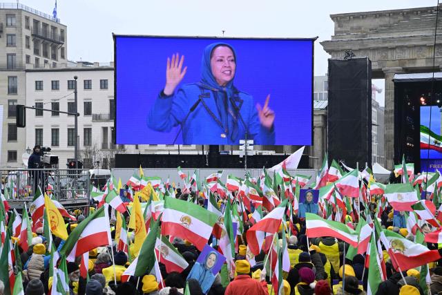 Maryam Rajavi (On display), leader of the People's Mujahedin of Iran (MEK), speaks to supporters during a demonstration against the Iranian government, in Berlin on February 7, 2026. (Photo by John MACDOUGALL / AFP)