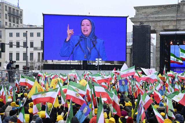 Maryam Rajavi (On display), leader of the People's Mujahedin of Iran (MEK), speaks to supporters during a demonstration against the Iranian government, in Berlin on February 7, 2026. (Photo by John MACDOUGALL / AFP)