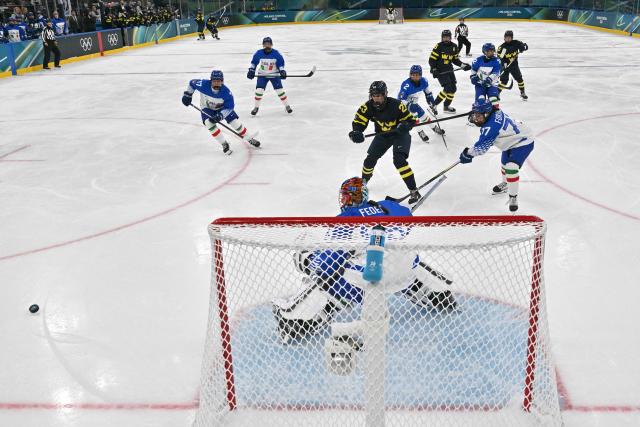 Italy's #25 Martina Fedel blocks the puck during the women's preliminary round Group B Ice Hockey match between Sweden and Italy at the Milano Santagiulia Ice Hockey Arena at the Milano Cortina 2026 Winter Olympic Games in Milan, on February 7, 2026. (Photo by JULIEN DE ROSA / POOL / AFP)