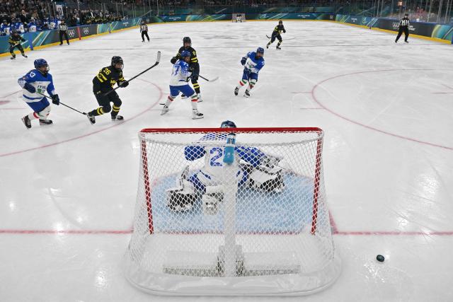 Italy's #25 Martina Fedel blocks the puck during the women's preliminary round Group B Ice Hockey match between Sweden and Italy at the Milano Santagiulia Ice Hockey Arena at the Milano Cortina 2026 Winter Olympic Games in Milan, on February 7, 2026. (Photo by JULIEN DE ROSA / POOL / AFP)