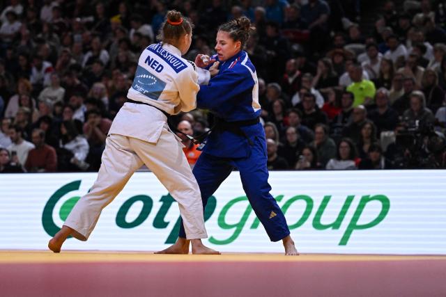 France's Manon Deketer (R) competes against Netherlands' Joanne van Lieshout (L) during the women's -63kg repechage at the Paris Grand Slam judo tournament in Paris on February 7, 2026. (Photo by Julie SEBADELHA / AFP)