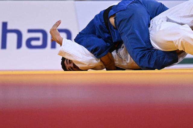 France's Dayyan Boulemtafes (below) competes against United Arab Emirates' Makhmadbek Makhmadbekov (top) during the men's -73kg Semi-Final at the Paris Grand Slam judo tournament in Paris on February 7, 2026. (Photo by Julie SEBADELHA / AFP)
