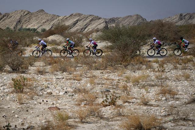 The pack rides during the first stage of the Tour of Oman cycling race from Muscat to Bimmah Sink Hole, in Bimmah, on February 7, 2026. (Photo by Loic VENANCE / AFP)