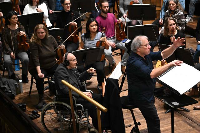 Hungarian composer Gyorgy Kurtag is seen on the stage of the Liszt Ferenc Academy of Music in Budapest on February 7, 2026 during his workshop with Hungarian symphony orchestra. The management of the Academy of Music paid tribute to the living legend of contemporary music who will celebrate his 100th birthday on February 19, 2026. (Photo by Attila KISBENEDEK / AFP)