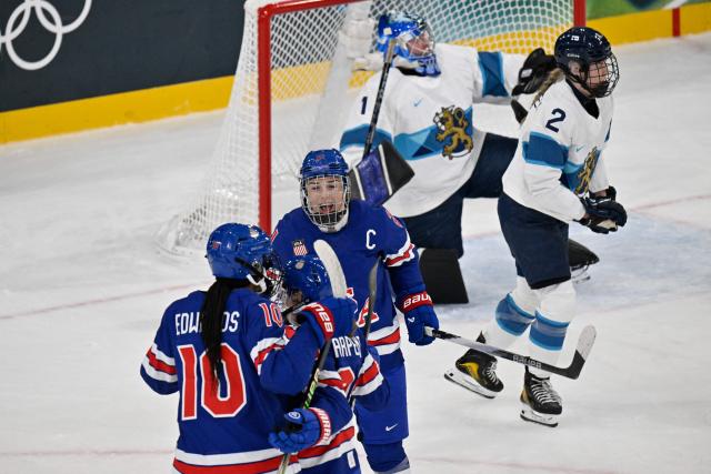 US' forward #21 Hilary Knight (3rd L) celebrates a goal by US' forward #25 Alex Carpenter (2nd L) during the women's preliminary round Group A Ice Hockey match between USA and Finland at the Milano Rho Ice Hockey Arena at the Milano Cortina 2026 Winter Olympic Games in Milan, on February 7, 2026. (Photo by Alexander NEMENOV / AFP)