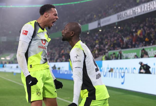 Dortmund's Guinean forward #09 Serhou Guirassy celebrates scoring with Dortmund's German midfielder #08 Felix Nmecha (L) his team's second goal during the German first division Bundesliga football match between VfL Wolfsburg and Borussia Dortmund in Wolfsburg, on February 7, 2026. (Photo by Ronny HARTMANN / AFP) / DFL REGULATIONS PROHIBIT ANY USE OF PHOTOGRAPHS AS IMAGE SEQUENCES AND/OR QUASI-VIDEO