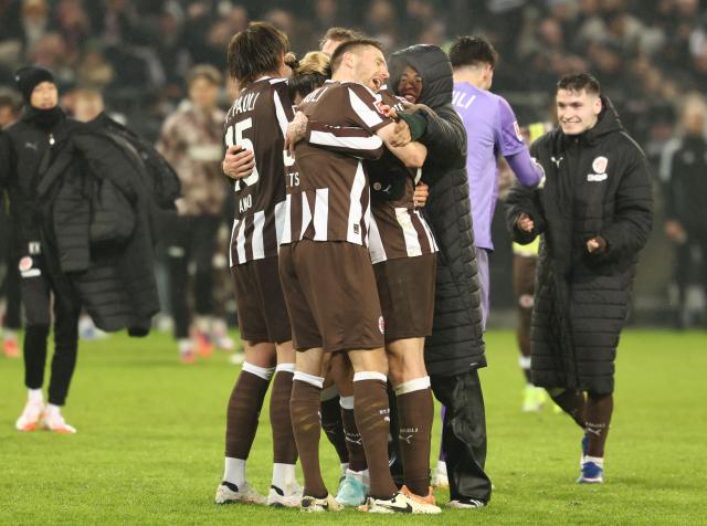 St Pauli's players react after the German first division Bundesliga football match between St Pauli and VfB Stuttgart in Hamburg, northern Germany, on February 7, 2026. (Photo by Ibrahim OT / AFP) / DFL REGULATIONS PROHIBIT ANY USE OF PHOTOGRAPHS AS IMAGE SEQUENCES AND/OR QUASI-VIDEO