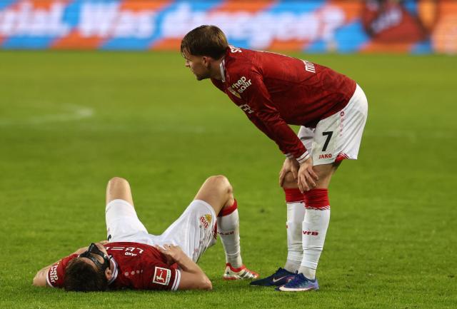 Stuttgart's German defender #07 Maximilian Mittelstaedt (R) reacts after the German first division Bundesliga football match between St Pauli and VfB Stuttgart in Hamburg, northern Germany, on February 7, 2026. (Photo by Ibrahim OT / AFP) / DFL REGULATIONS PROHIBIT ANY USE OF PHOTOGRAPHS AS IMAGE SEQUENCES AND/OR QUASI-VIDEO
