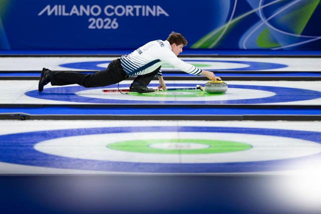 Czech Republic's Vit Chabicovsky competes in the curling mixed doubles round robin between South Korea and Czech Republic during the Milano Cortina 2026 Winter Olympic Games at the Cortina Curling Olympic Stadium in Cortina d’Ampezzo on February 7, 2026. (Photo by Odd ANDERSEN / AFP)