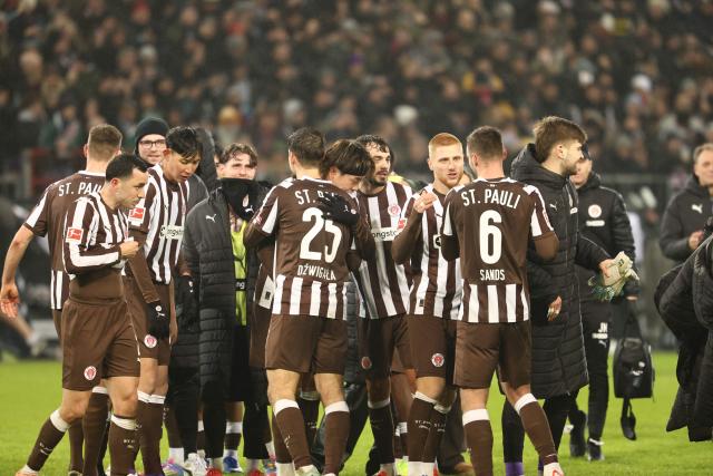 St Pauli's players react after the German first division Bundesliga football match between St Pauli and VfB Stuttgart in Hamburg, northern Germany, on February 7, 2026. (Photo by Ibrahim OT / AFP) / DFL REGULATIONS PROHIBIT ANY USE OF PHOTOGRAPHS AS IMAGE SEQUENCES AND/OR QUASI-VIDEO
