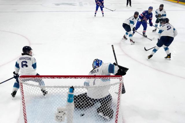 US' forward #25 Alex Carpenter (3rd R) scores the opening goal  during the women's preliminary round Group A Ice Hockey match between USA and Finland at the Milano Rho Ice Hockey Arena at the Milano Cortina 2026 Winter Olympic Games in Milan, on February 7, 2026. (Photo by Darko Bandic / AFP)