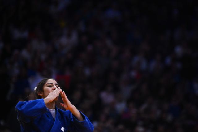 France's Shirine Boukli celebrates after winning against China's Wenna Zhuang the women's -48kg Final at the Paris Grand Slam judo tournament in Paris on February 7, 2026. (Photo by Julie SEBADELHA / AFP)
